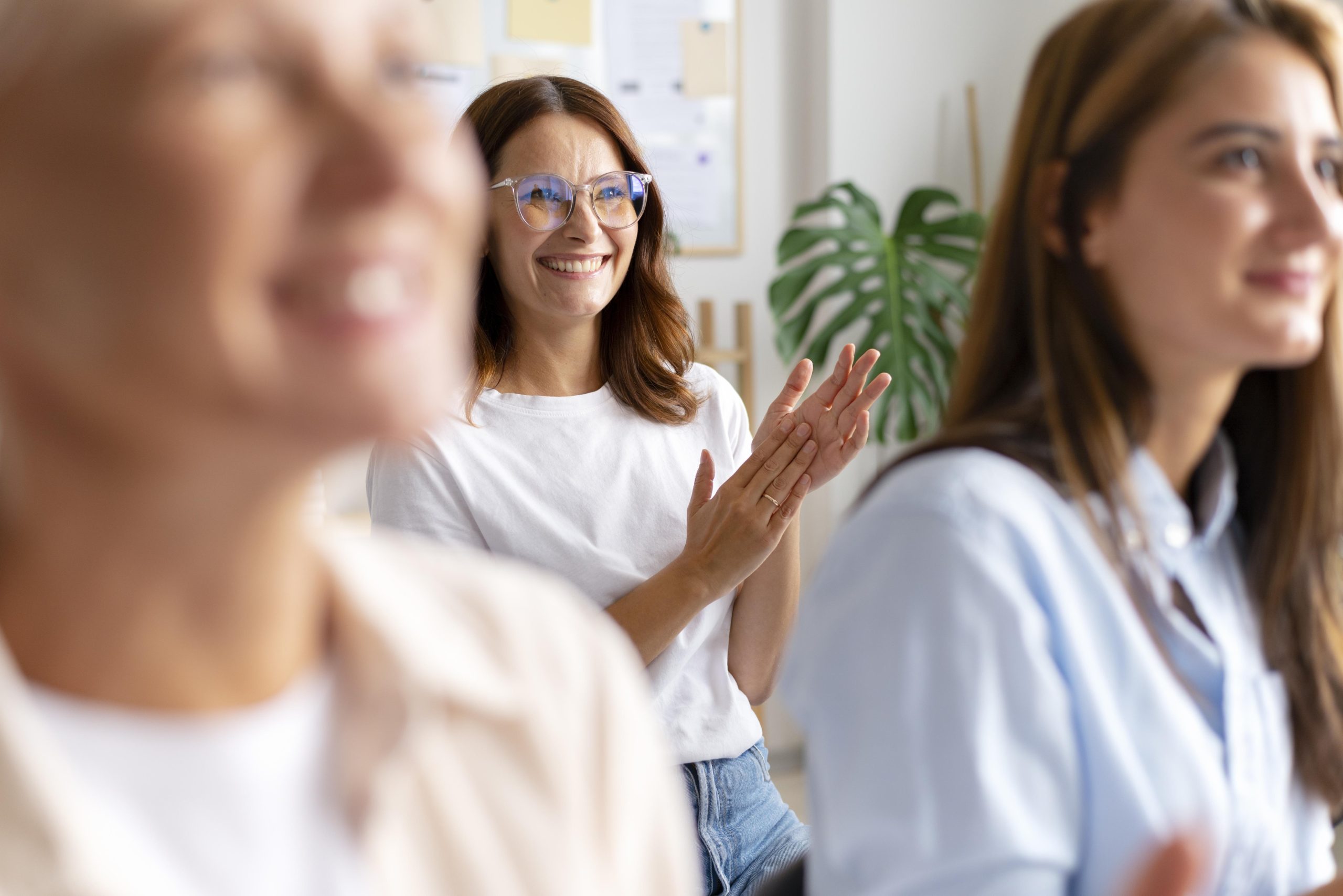 Woman clapping at seminar